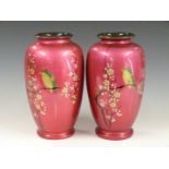 A pair of Japanese lacquered / enamelled vases decorated with birds and prunus blossom, printed