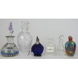 Five glass scent bottles including an English millefiori, Chanel No.19, one with white metal penguin