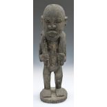 African tribal carved figure carrying dead game, H39cm