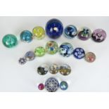 Twenty Isle of Wight, Caithness, Strathern and similar glass paperweights including iridescent and