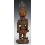 African tribal Yoruba carved fertility / fetish figure with hooped decoration around both arms and