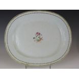 A 19thC Chinese famille rose oval plate with central floral decoration, 33x38cm