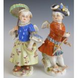 Two Meissen putti, each with blue crossed swords mark to base, H9.5cm