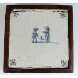 Delft tile with decoration of golfers, diameter 14.5cm