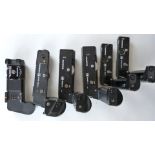 Five Olympus camera winders comprising two motor drive 1, one motor drive 2 amd two winder 2,