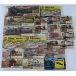 Twenty-four Airfix 00 gauge model railway plastic model kits including wagons, tankers. buildings,