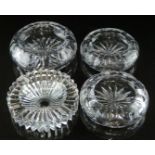 Four clear cut glass ashtrays comprising one Joseph Riedel with starburst design and three Tudor