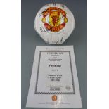Two Manchester United signed footballs, one signed by members of the 1999 treble winning squad