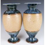 A pair of Doulton Lambeth pedestal vases, H20cm