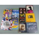 Beatles memorabilia including books, DVD, puzzles and newspapers
