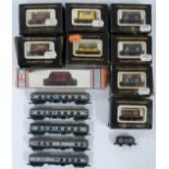 Graham Farish N gauge model railway rolling stock comprising five BR blue coaches, nine goods wagons