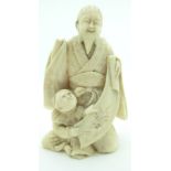 Japanese Meiji period ivory okimono of a bearded elder with child, H8.5cm