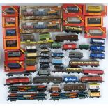 Fifty-two Hornby, Hornby Dublo, Tri-ang, Bachmann and similar 00 gauge model railway wagons, vans