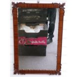 A walnut framed mirror with moulded decorative frame, 84x55cm