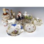A collection of ceramics including German animal figures in the style of Nymphenburg, majolica,