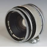 Canon 35mm f 1:1.8 camera lens with screw mount and Leica lens cap