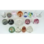 Seventeen glass paperweights and small vases including Caithness, Orrefors, Wedgwood etc, some