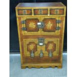 Oriental cabinet with three drawers and two cupboards, raised on a shaped apron W61 x D34 x H82 cm