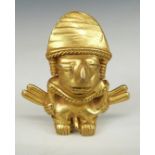Colombian gilt metal figure with suspension loops verso, H5.5cm