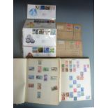 Two stamp albums of all world stamps mostly first half 20thC, two early first day covers for