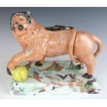 Staffordshire Obadiah Sherratt style pottery figure of a lion with ball, on sponge decorated base,