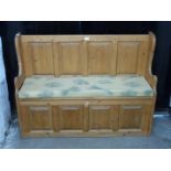 Pine panelled settle with lift up seat, L119cm