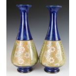 A pair of Royal Doulton vases impressed 8884 and HJ, H28cm