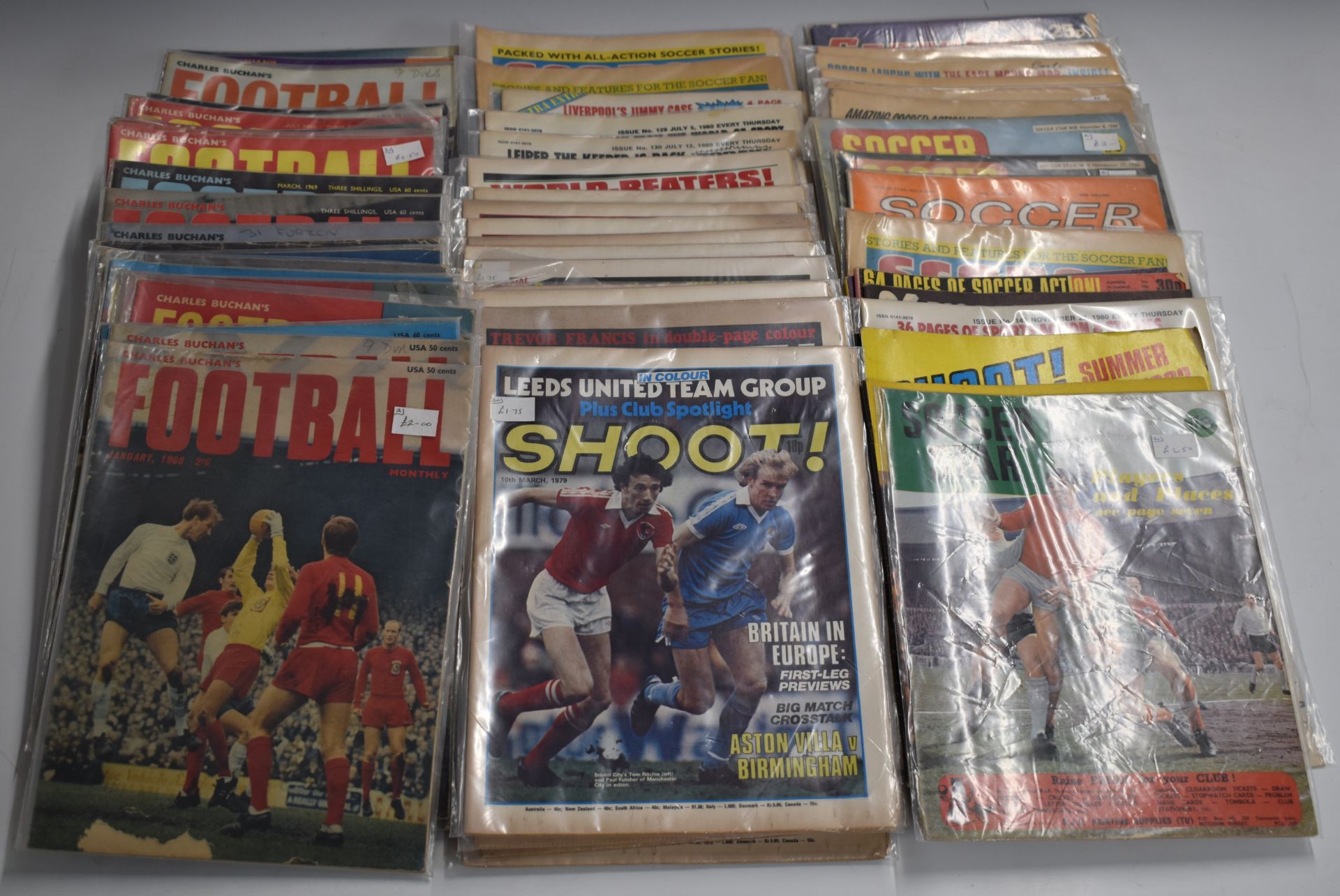 Fifty-five football related magazines comprising 32 Chares Buchan Football Magazine dating from