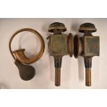 Two carriage lamps, one marked Limehouse Lamp Co, height 41cm, and a brass bulb horn