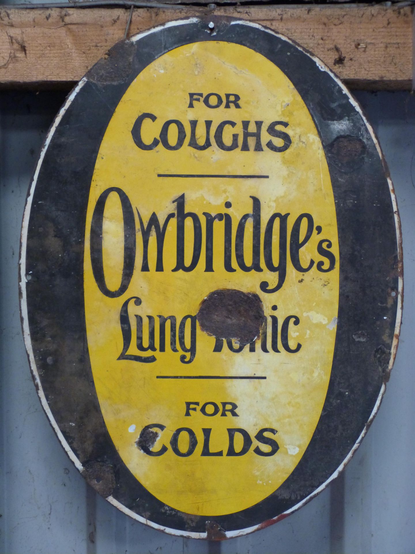 Vintage enamel advertising sign 'Owbridge's Lung Tonic for coughs, for colds', maximum diameter 57cm