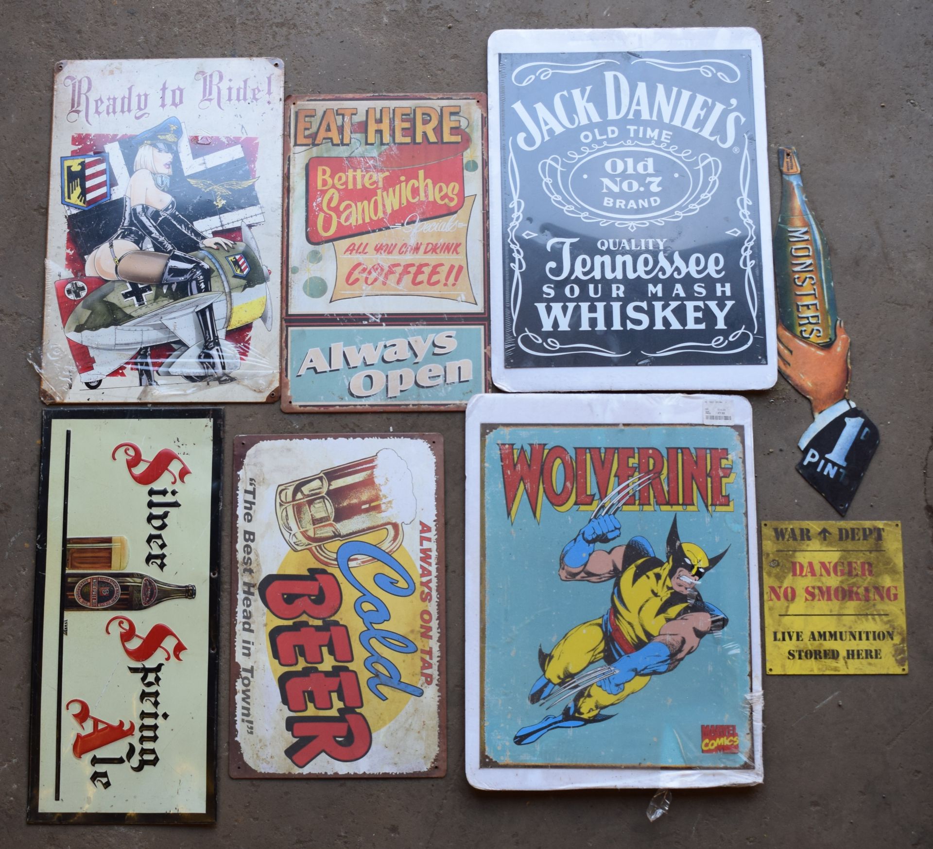 Eight metal advertising signs to include Jack Daniel's, beer etc, largest approximately 40 x 30cm