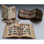 Two early albums of all-world stamps, loose stamps and a cigarette card album including horse racing