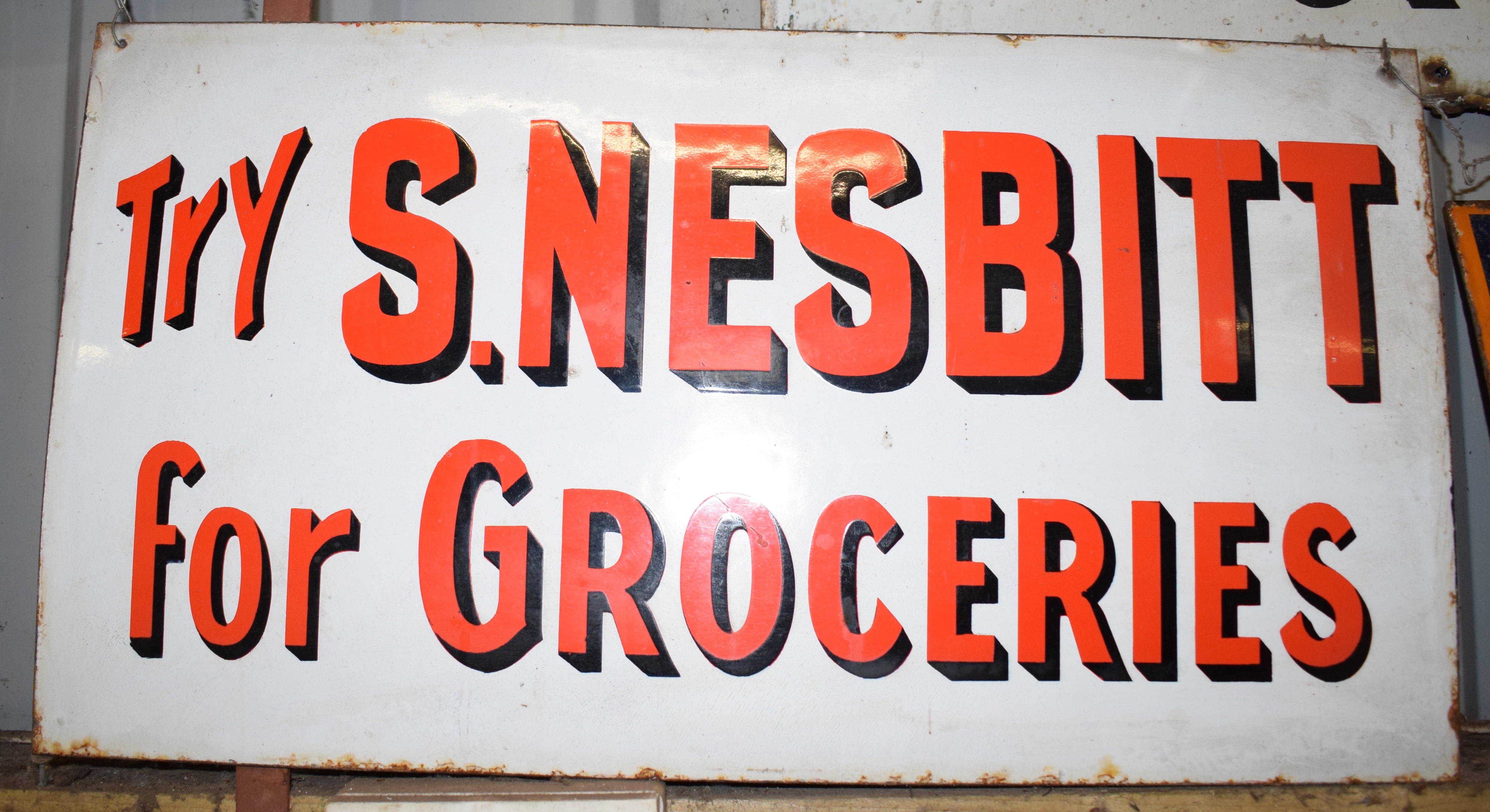 Vintage enamel advertising sign 'S Nesbitt for Groceries', 35.5 x 66cm PLEASE NOTE this lot is