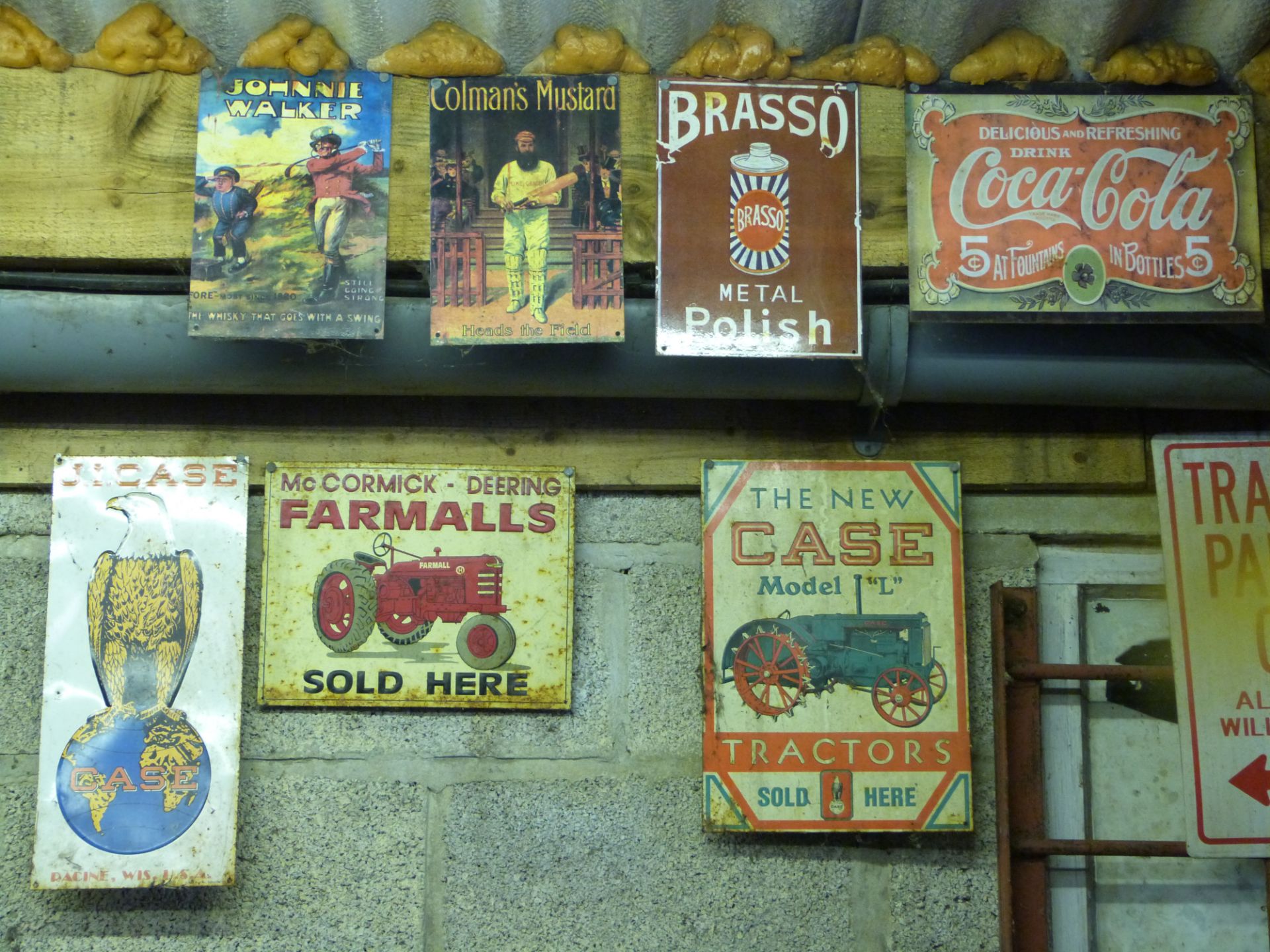 Nine metal advertising signs including Case, Farmalls and Brasso, approximately 40 x 30cm PLEASE