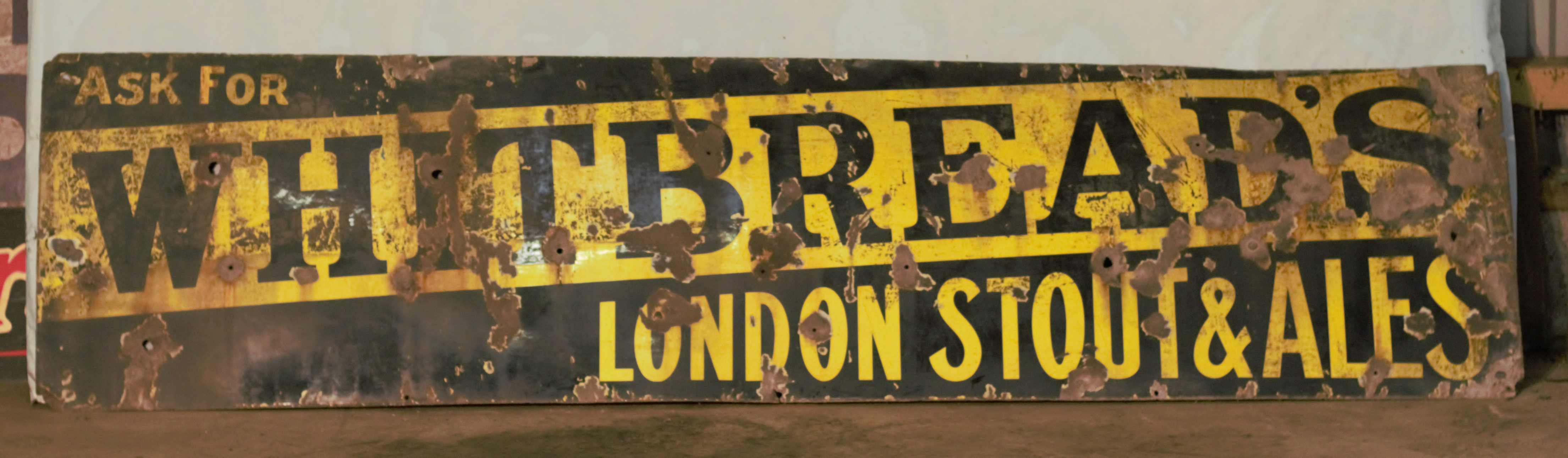 Vintage enamel advertising sign 'Whitbread's London Stout & Ales', 61 x 244cm PLEASE NOTE this lot