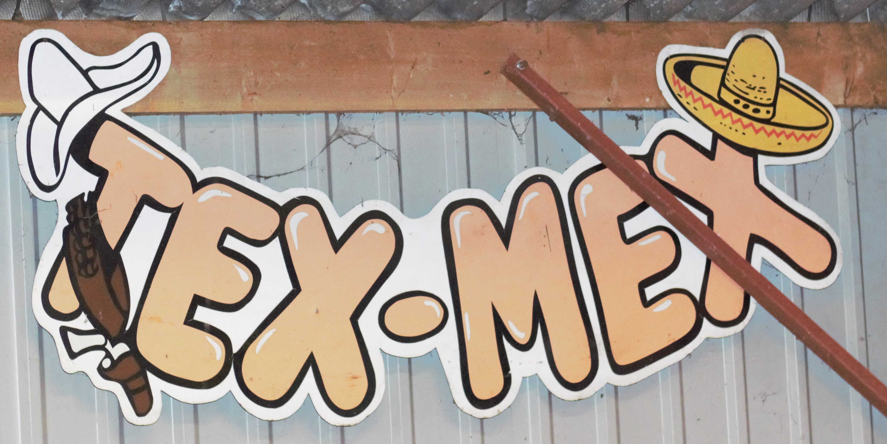 Vintage advertising sign 'Tex-Mex', 78 x 176cm PLEASE NOTE this lot is located at and will be sold