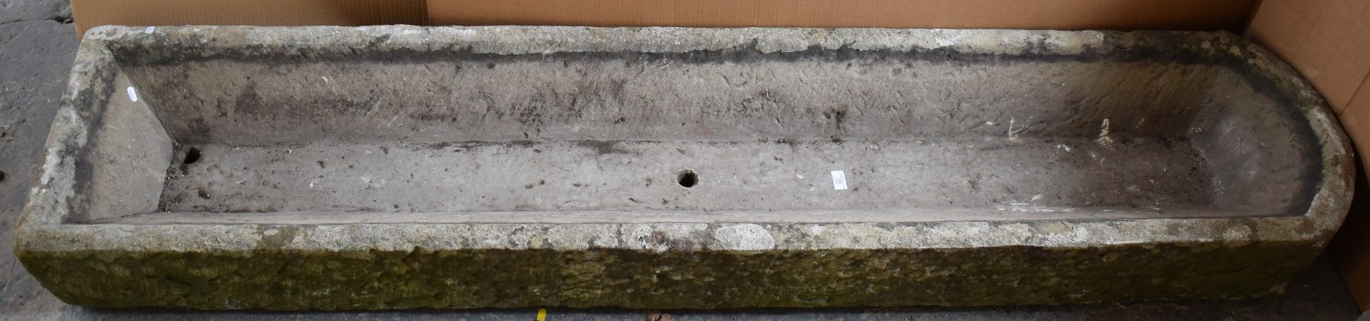 A natural stone trough, W214 x D44 x H20cm