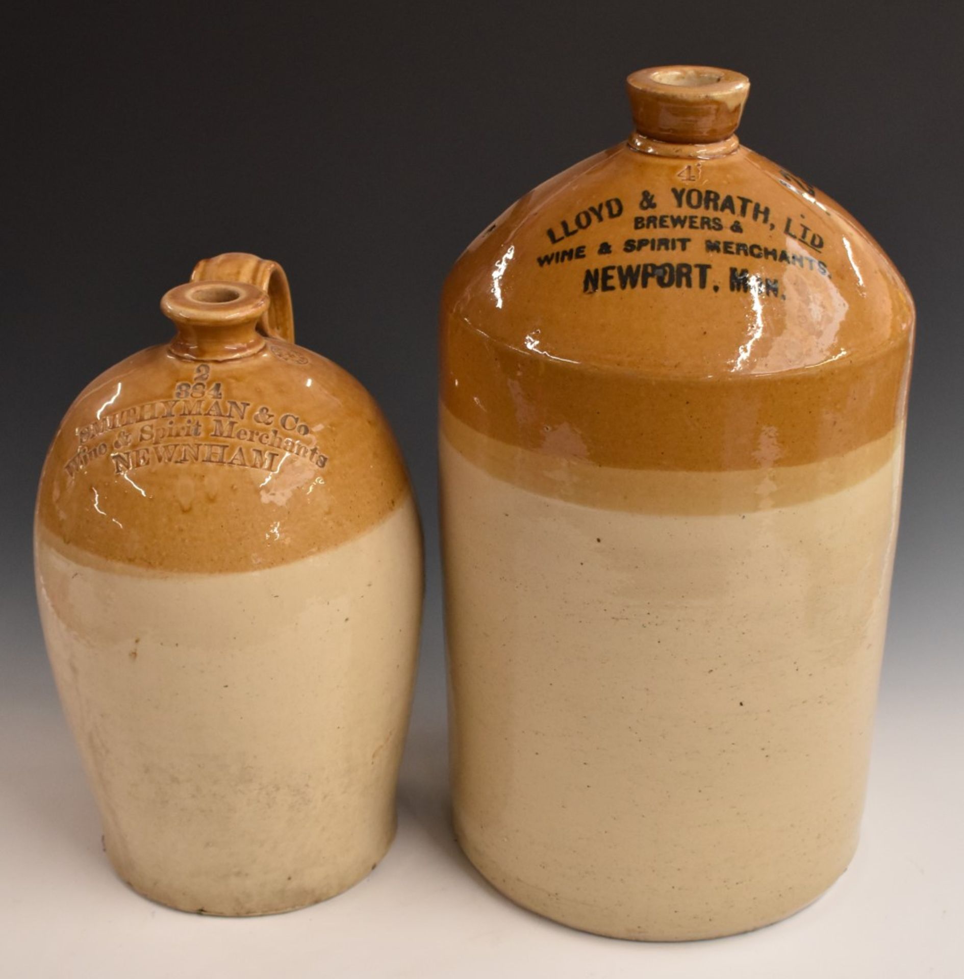 Two stoneware flagons for Smithyman and Co Newnham (on Severn) Gloucestershire and Lloyd and