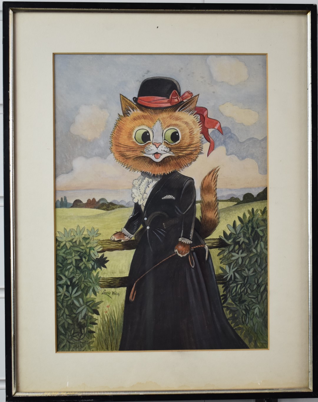 In the manner of Louis Wain novelty portrait of a cat dressed ready to go riding, with crop in her - Image 2 of 3