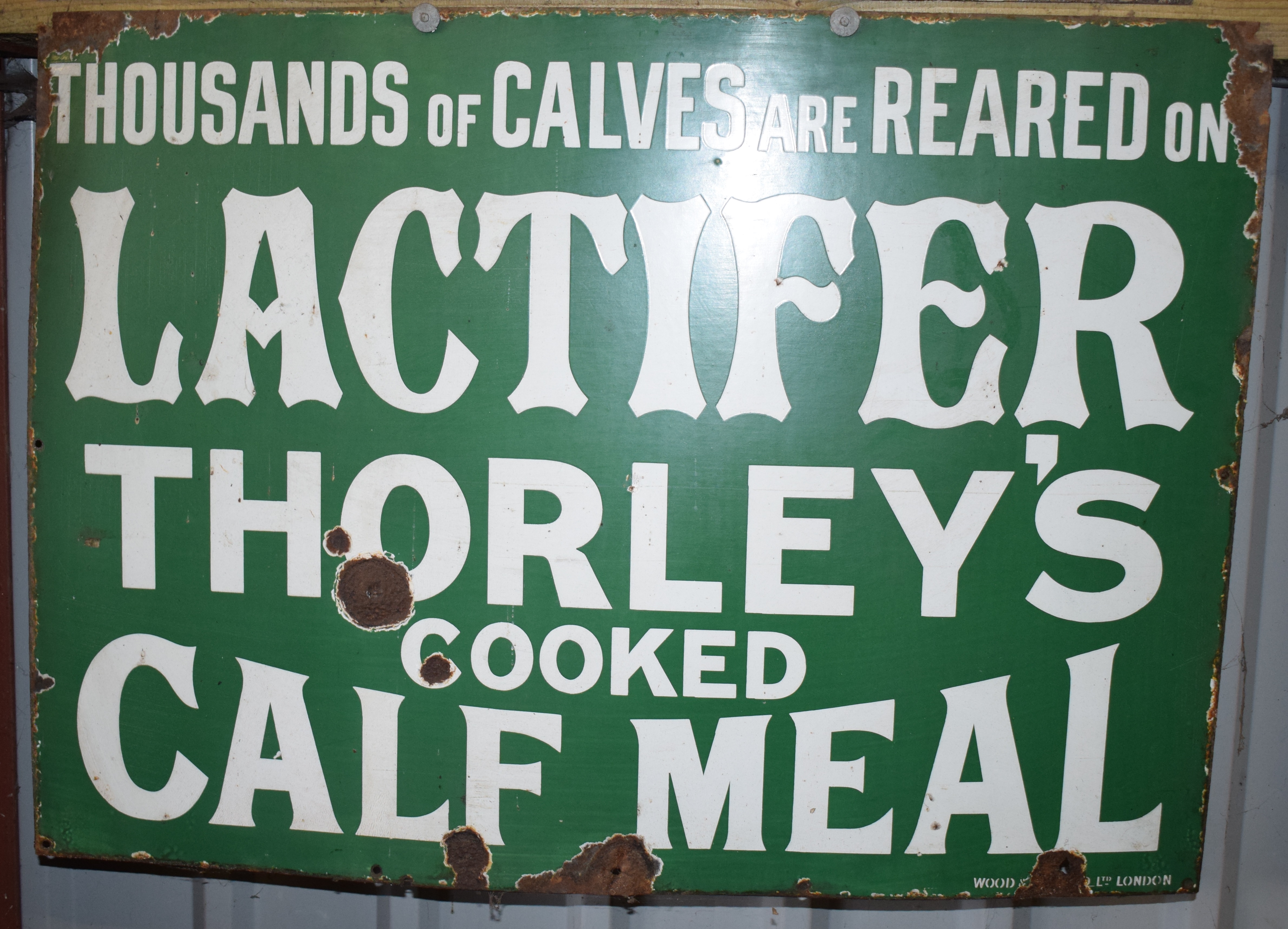 Vintage enamel advertising sign 'Lactifer Thorley's Cooked Calf Meal', 58 x 81cm PLEASE NOTE this