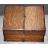 An oak tabletop stationery box with fitted interior, W38 x D21 x H29cm