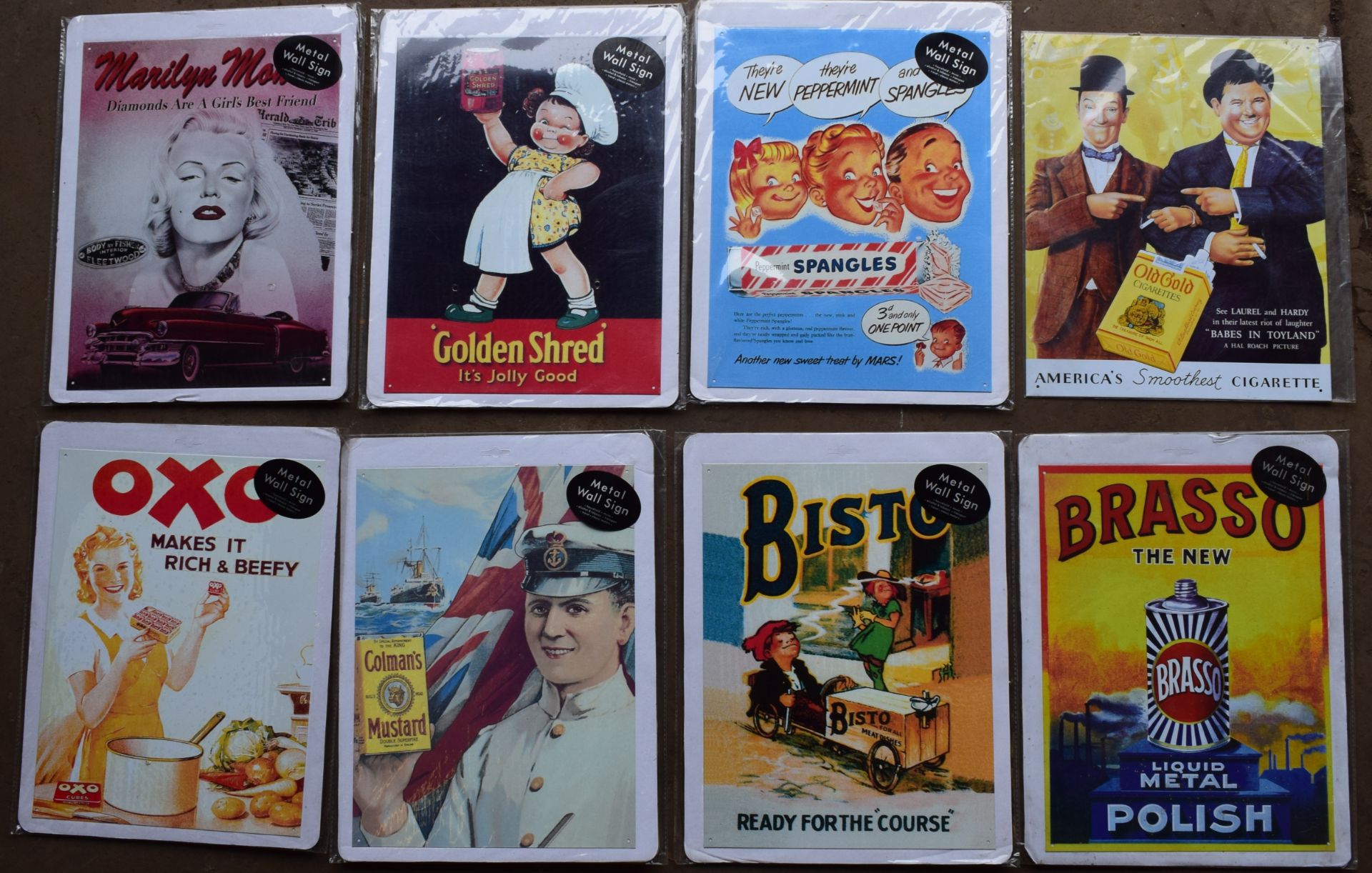 Eight metal advertising signs to include Brasso, Bisto, Colman's mustard, Oxo and Golden Shred, each