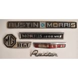 Five motor car badges comprising Austin, MG BGT, Anglia, Austin Morris and Morris 1800 MKII