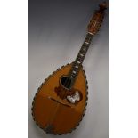 Unlabelled late 19thC semi flat backed mandolin, the tortoiseshell pick guard inlaid with mother-