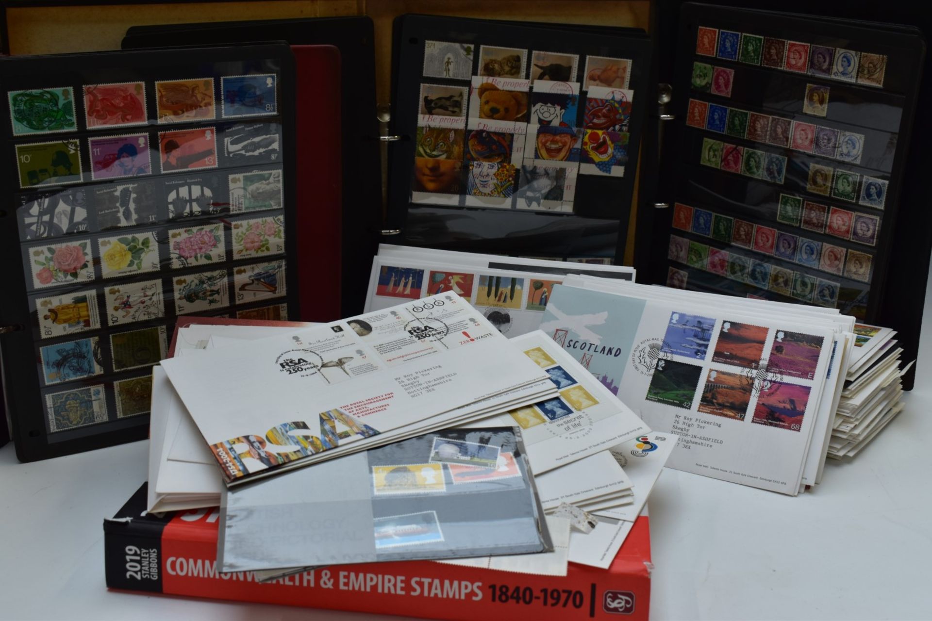 A box of GB stamps including first day covers, presentation packs and albums