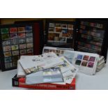 A box of GB stamps including first day covers, presentation packs and albums