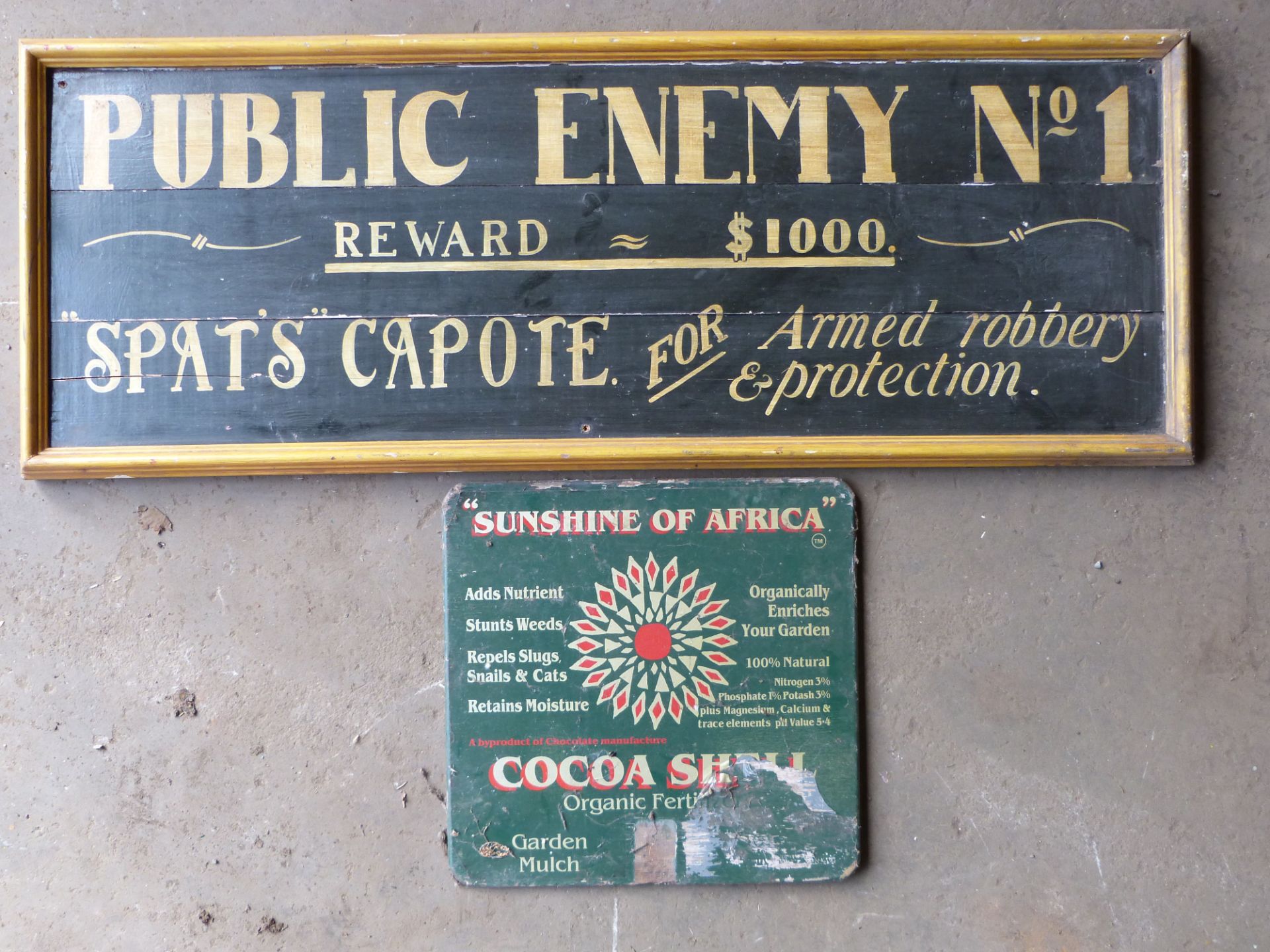 Two wooden signs comprising Public Enemy No 1 & Sunshine of Africa fertilizer, 49 x 130cm  PLEASE