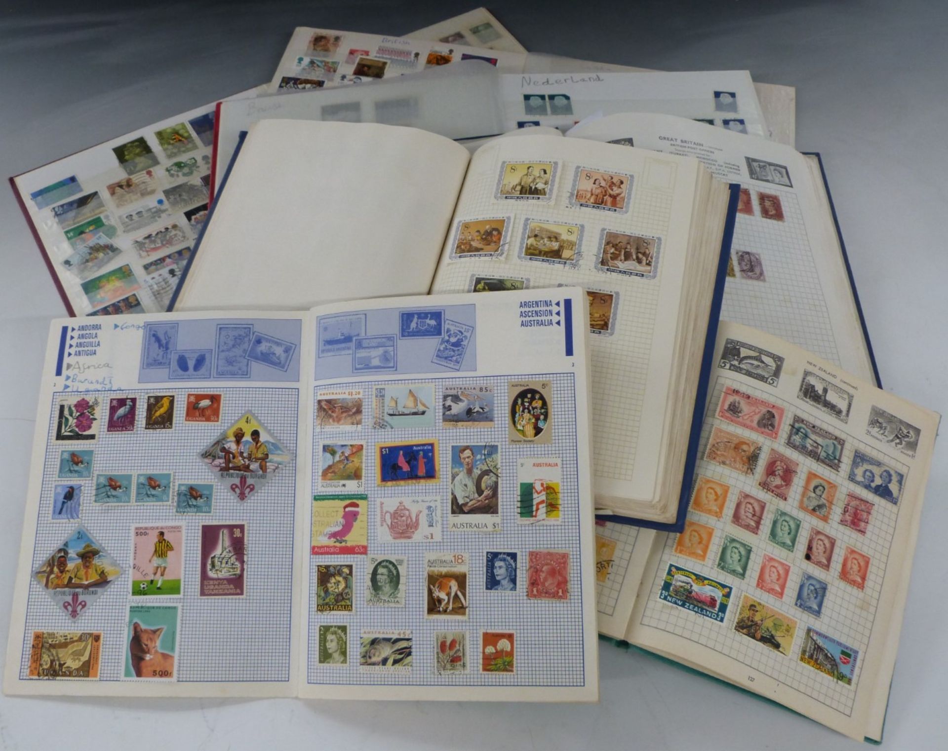 Seven stamp albums and stockbooks of all world stamps, all reigns