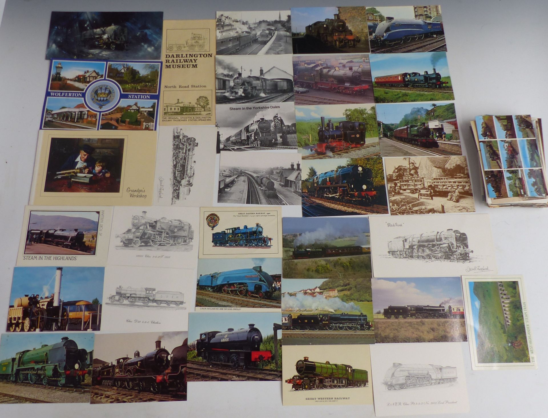 Over 100 postcards relating to trains, railways and bridges