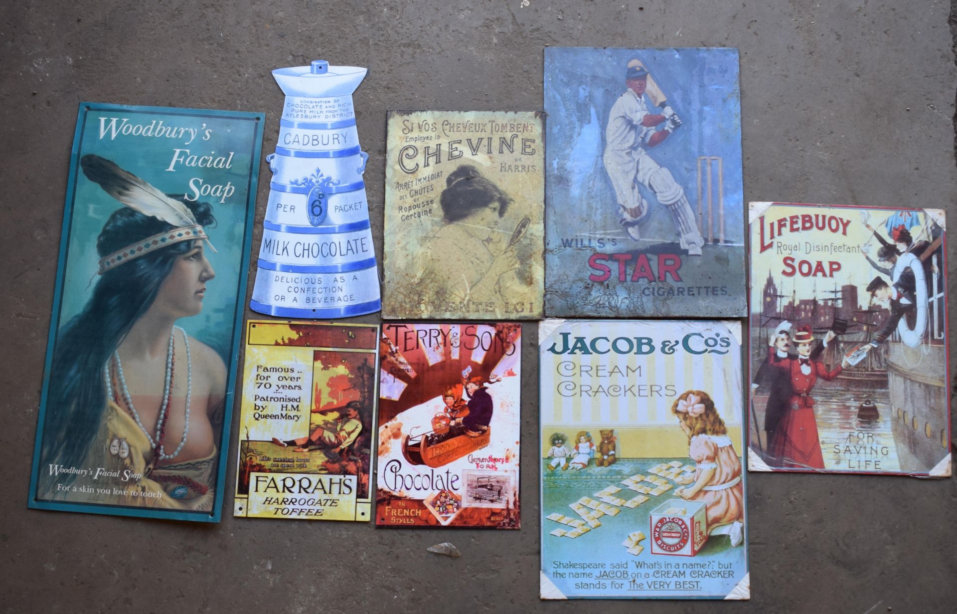 Eight metal advertising signs to include Cadbury, Wills's etc PLEASE NOTE this lot is located at and